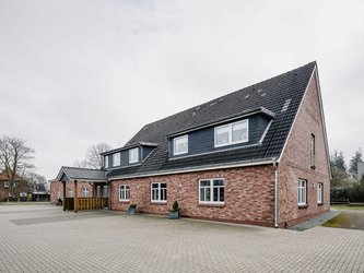 Dörpshus Lütjenholm rotes Backsteinhaus